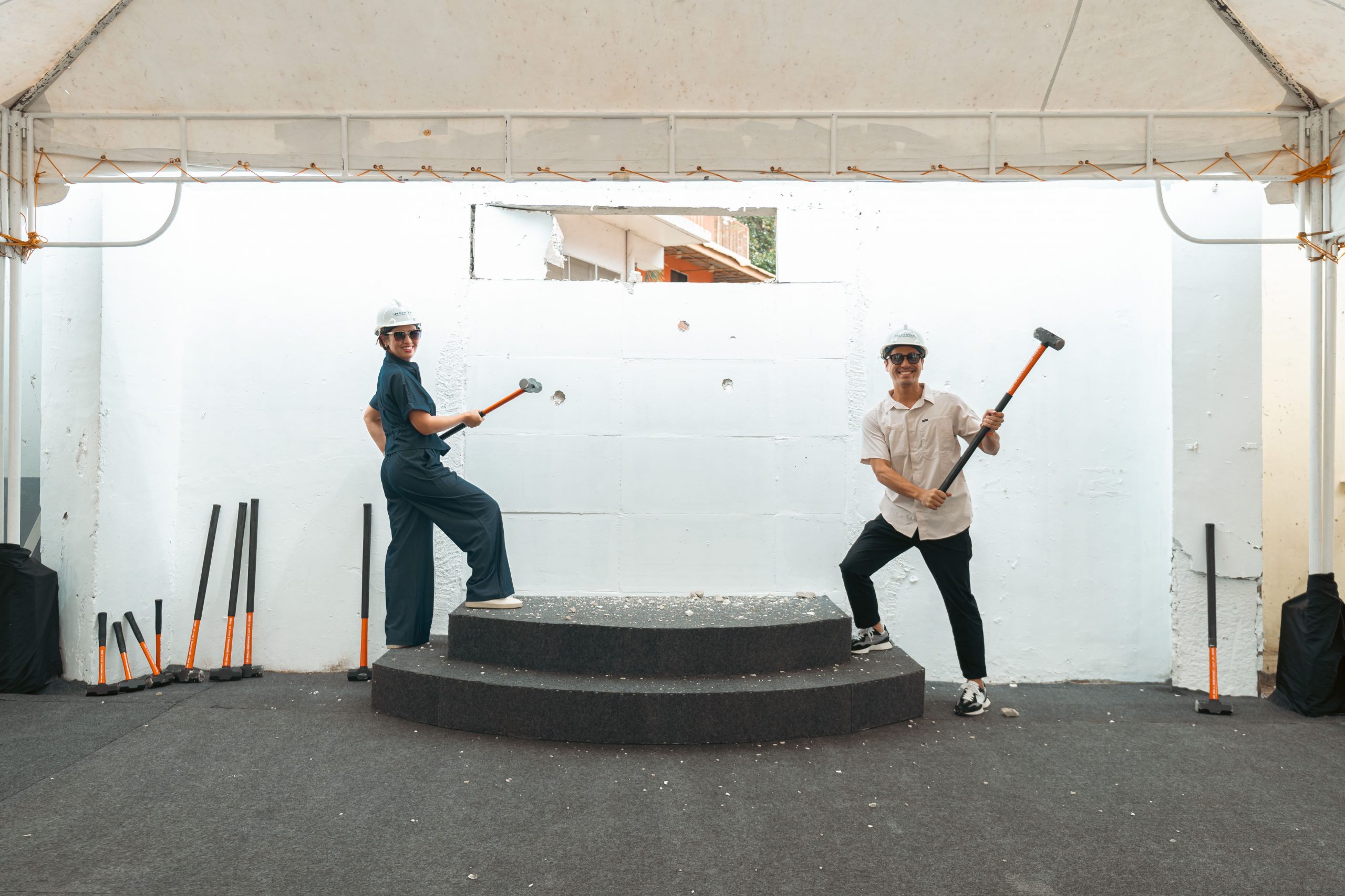 Jeremiah Tan with Kyle Wong as they take a swing at the wall